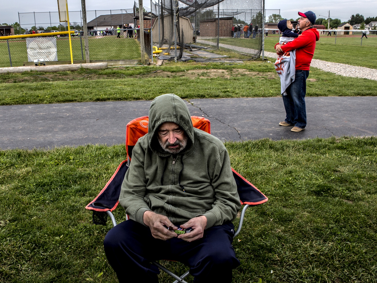 Tom Engeman sits apart from the crowd at his granddaughter's tee-ball game. Tom has no idea he is at a tee-ball game or that it is his...