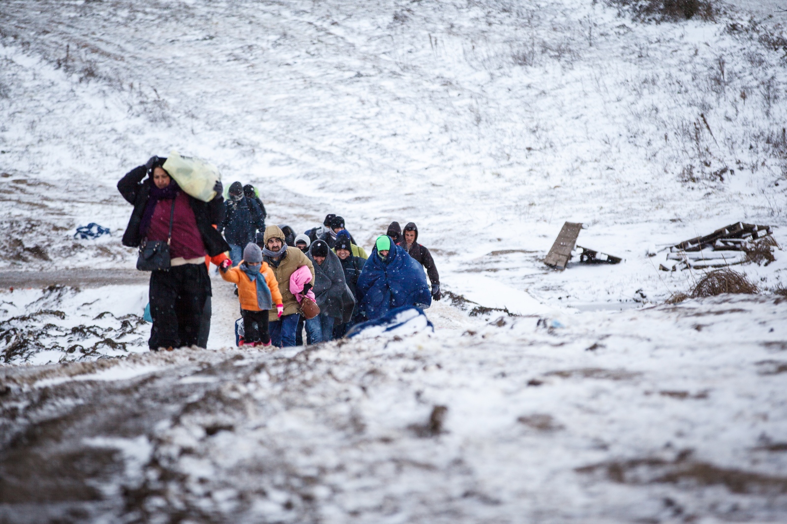 Crossing Serbia - In subfreezing snowy weather, refugees hike the unoffical...