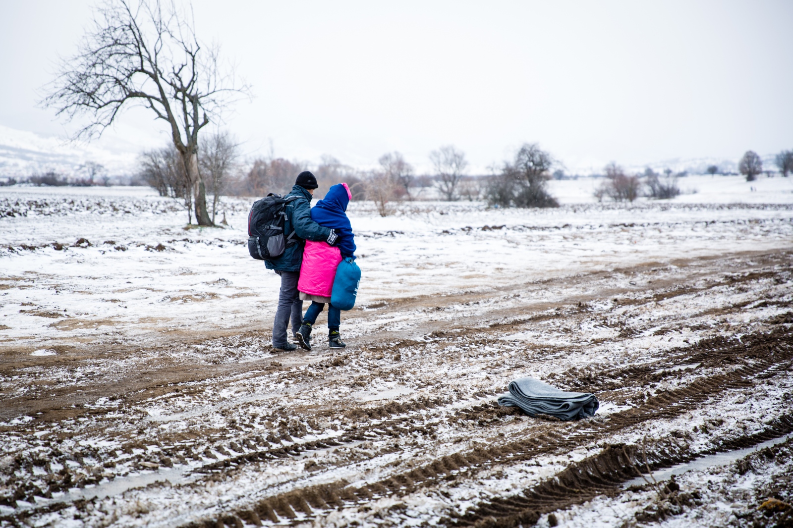 Crossing Serbia - In subfreezing snowy weather, refugees walk the unoffical...
