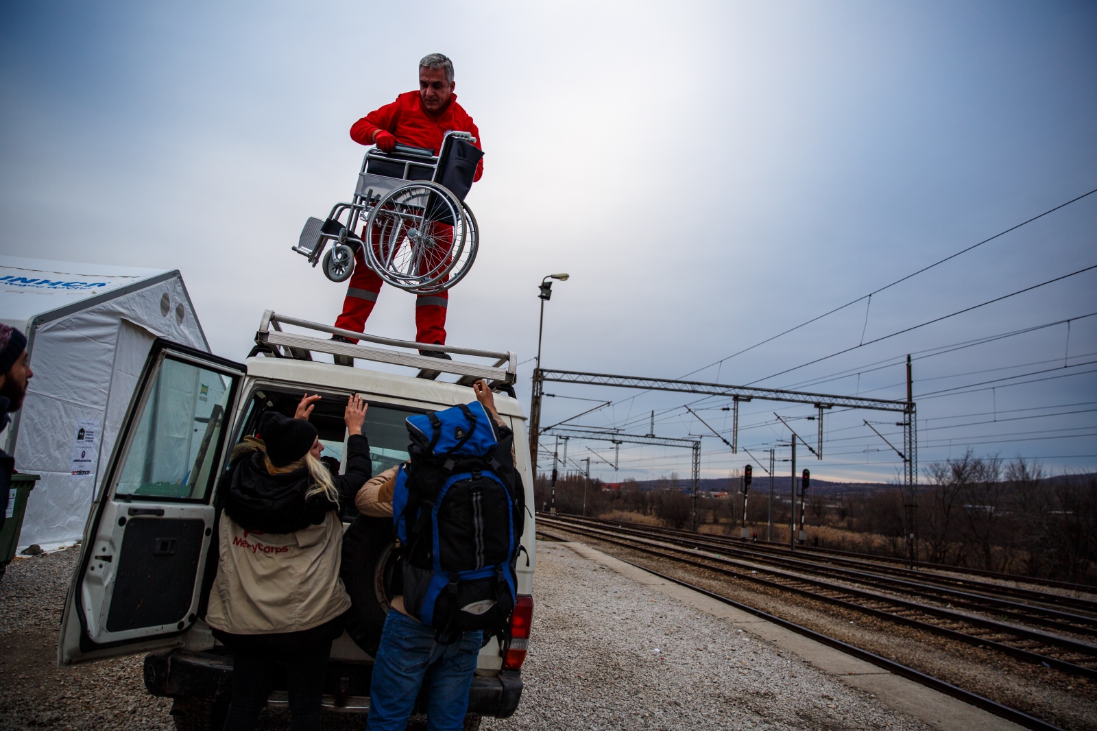 Crossing Serbia -                                 Aide workers load a...