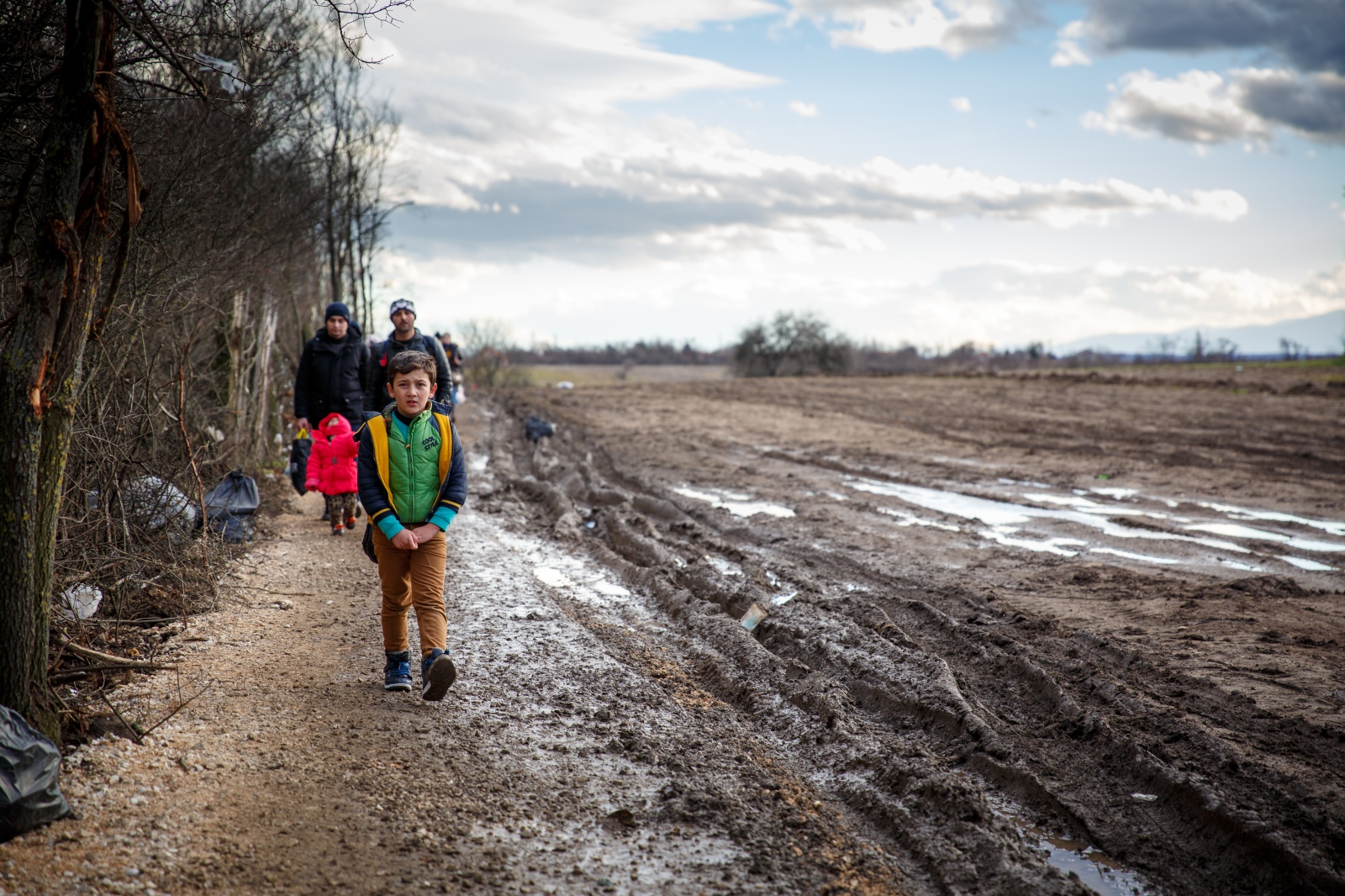 Crossing Serbia -                                 Refugees walk the...