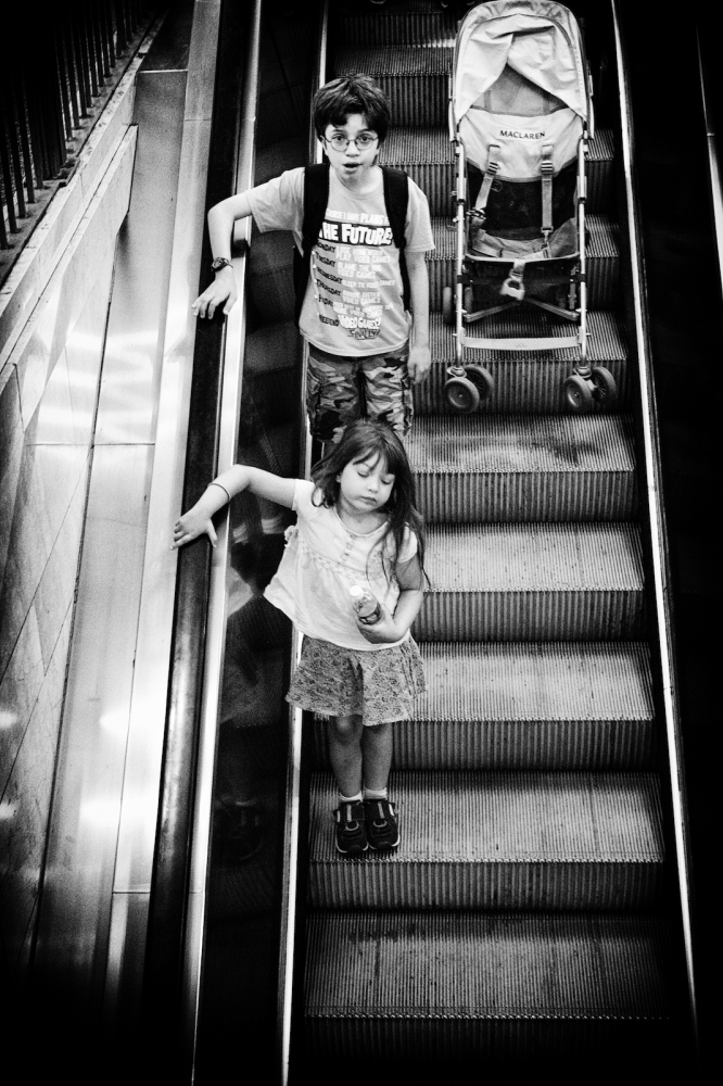  Commuters and tourists ride the escalator down to the trains at Grand Central Terminal, New York, NY. 