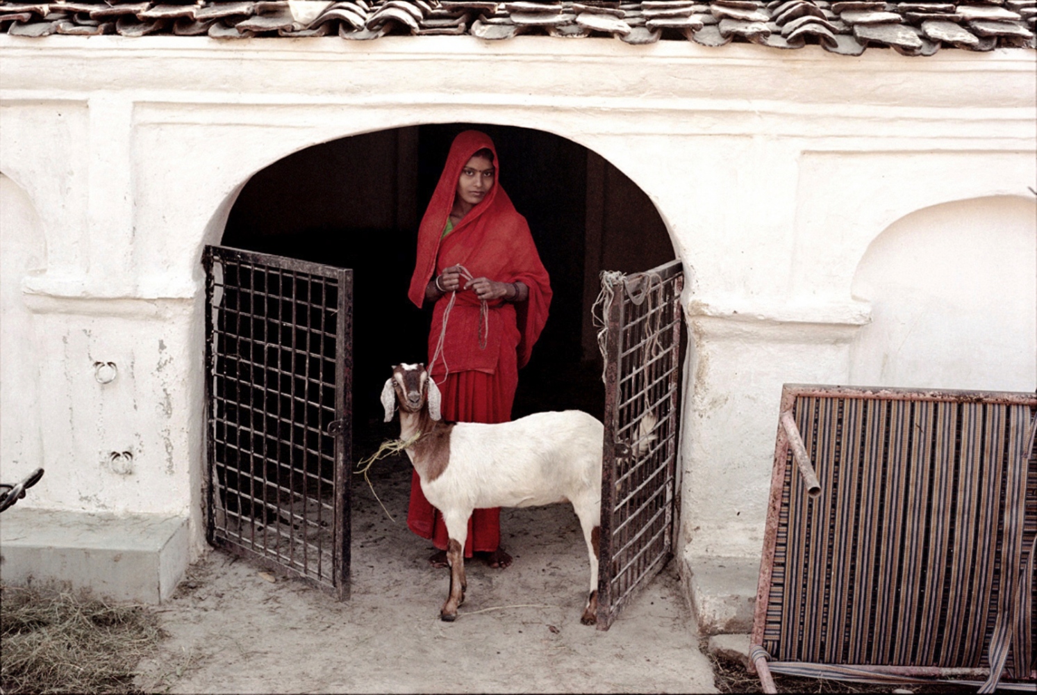 India -  Lady in Red, Khajuraho, India, November 2003   