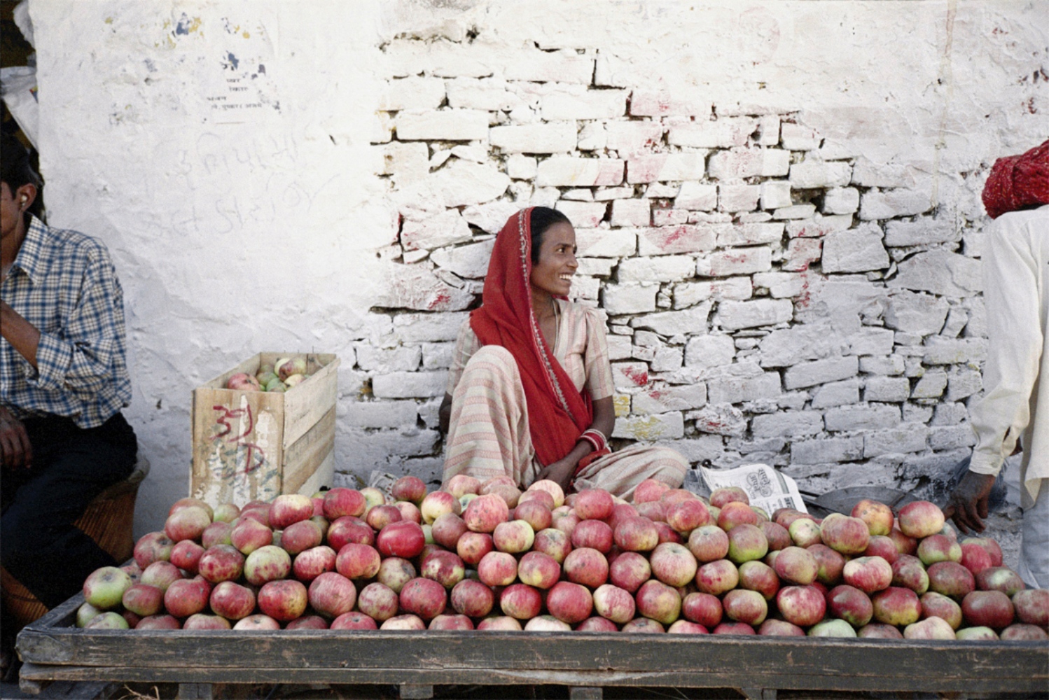 India -  Lady and Apples, Pushkar, India, November 2003 