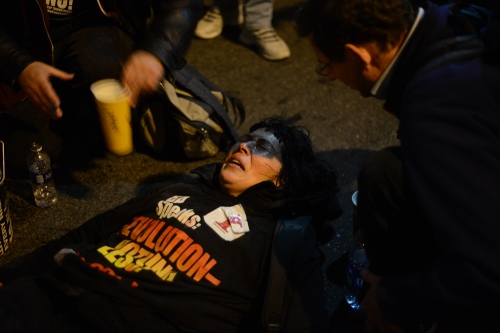     A protester receives medical attention after being tear gassed at a march against fascism in DC the eve before Donald Trump's Inauguration. January 19th, 2017     