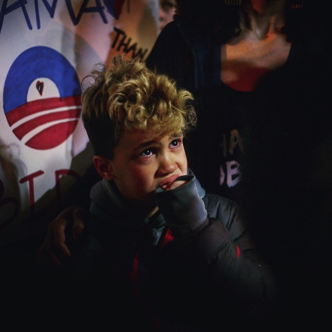 Image from Protest  -    A child at a "Thank you Obama" rally outside...