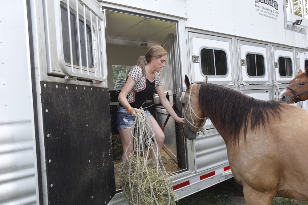 Taylor Young feeding Tsunami before the Malibu Rodeo in Milford, Pennsylvania.Â (Kevin C. Downs/Agence Cosmos) 