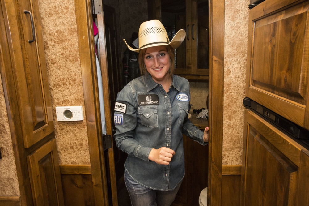  Taylor Young with her mother Anna Shields-Young and Jayme Myers, her sister, and trainer, inside of their caravan, discussing her ride tonight at the Malibu Rodeo in Milford, Pennsylvania. This is the first time her mother will be seeing Taylor compete in a rodeo.Â (Kevin C. Downs/Agence Cosmos) 