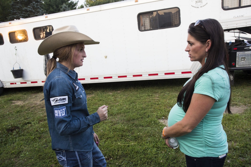  Taylor Young talking to Jayme Myers, her sister, and trainer, about barrel-racing techniques at Malibu Rodeo in Milford, Pennsylvania.Â Â (Kevin C. Downs/Agence Cosmos) 