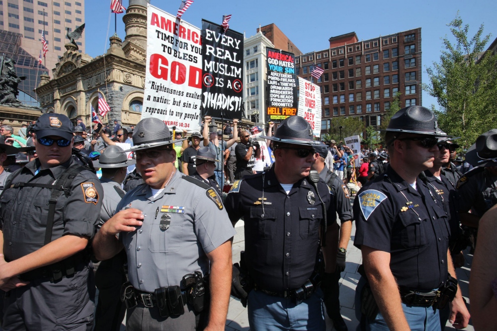 Image from The 2016 Republican National Convention - Police in Cleveland, Ohio protect members of Westboro...