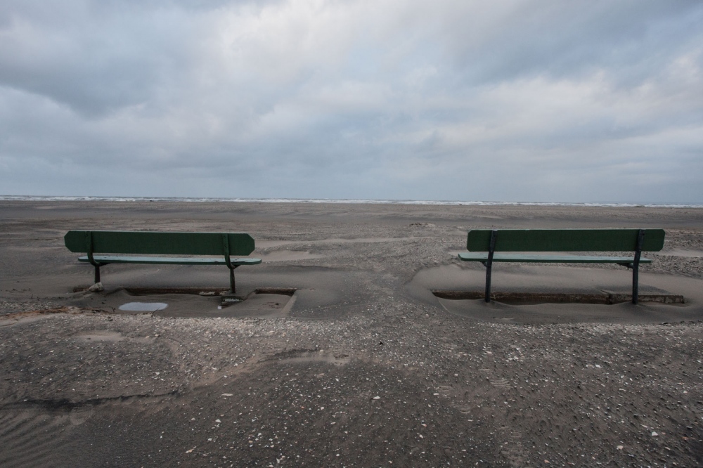 Two benches remain on the beach...evastation of Hurricane Sandy. 