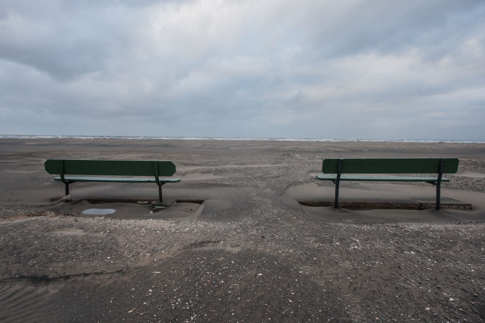 The Rockaways After Hurricane Sandy - Two benches remain on the beach at Breezy Point after the...