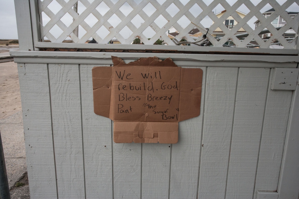 Sign that says "We will re...t" after Hurricane Sandy. 