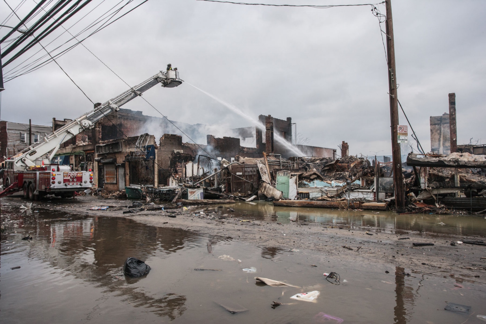The Rockaways After Hurricane Sandy - Firemen put out fires on Bay Blvd. after Hurricane Sandy. 