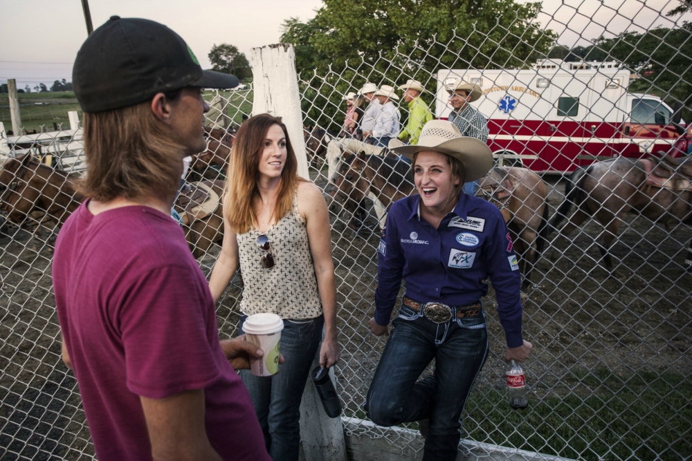 Taylor Young, (R) a young 22-year old Professional Rodeo Athlete, with friends at Cowtown Rodeo, before she rides in the event that she eventually lost that evening. 