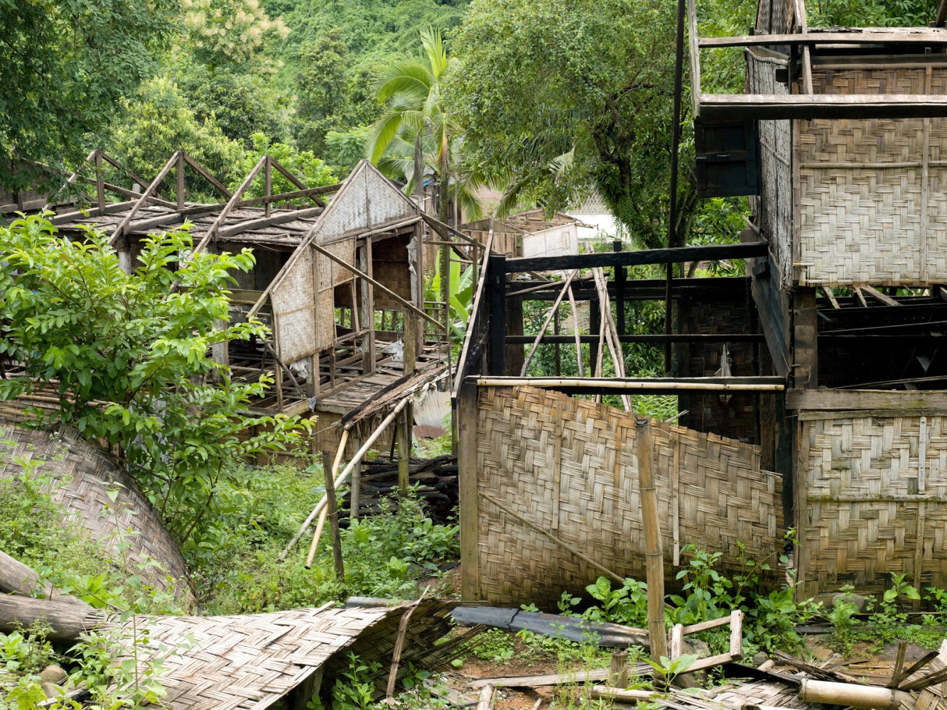 The Corridor of Opportunity - The Nam Ou - The remains of abandoned houses in Ban Meuanghoun...