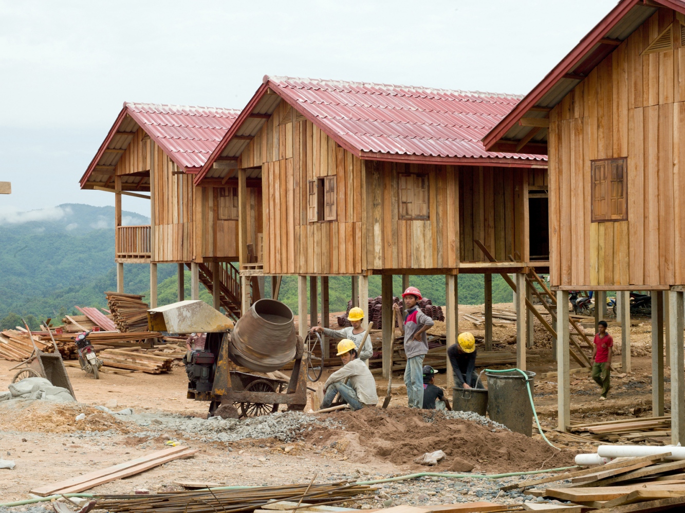 The Corridor of Opportunity - The Nam Ou - Vietnamese construction workers building the new village...