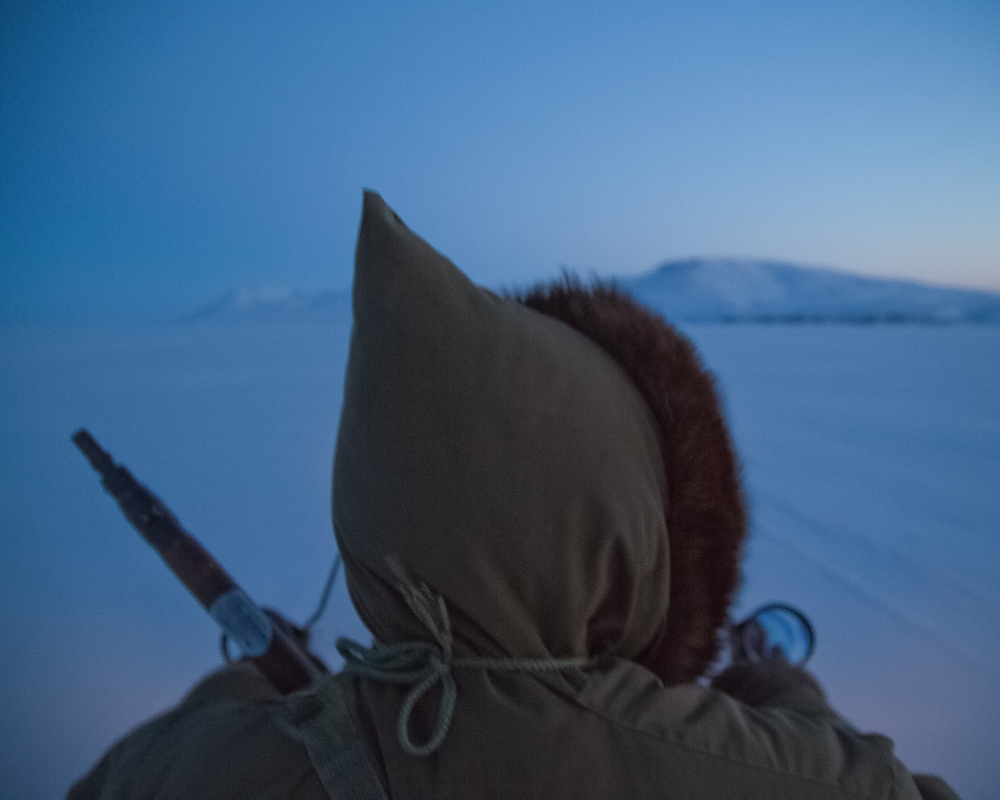  Joseph Kigutaq drives his skid... the sea ice near Arctic Bay.Â 