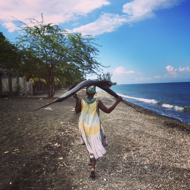 Along Grand Goave beach (Haiti),_e has just bought from fishermen
