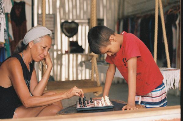 Mother and Child playing chess  | Buy this image