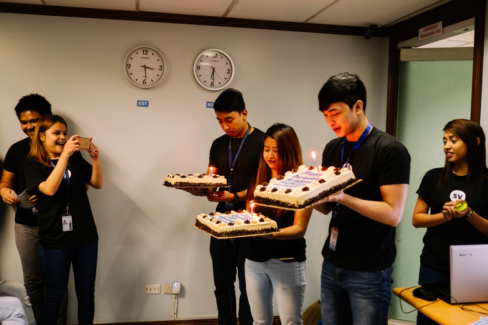 7Am. Once a month in this call center company, owned by Americans, there is an informal meeting to celebrate every birthday from that month. These 3 birthday people were just about to finish their night work shift. Makati, Manila, Philippines. 15th April, 2016.