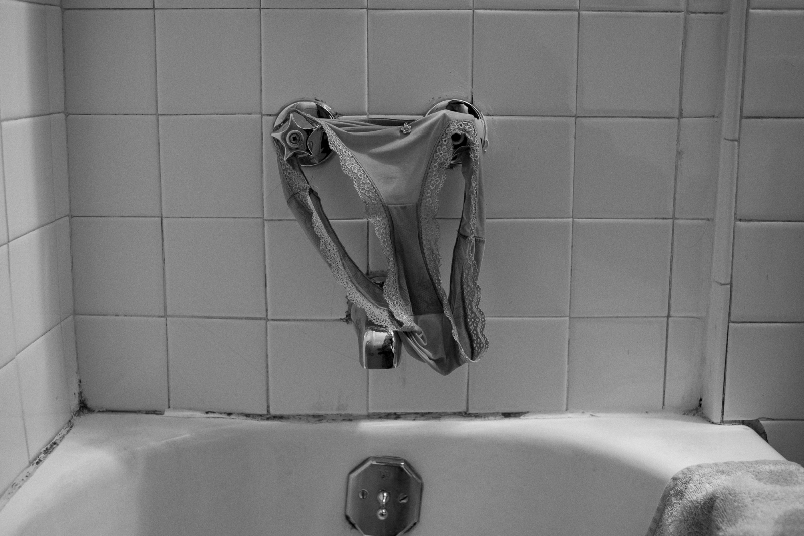 Born Twice -  Hanging underwear left to dry on the bathtub faucet...
