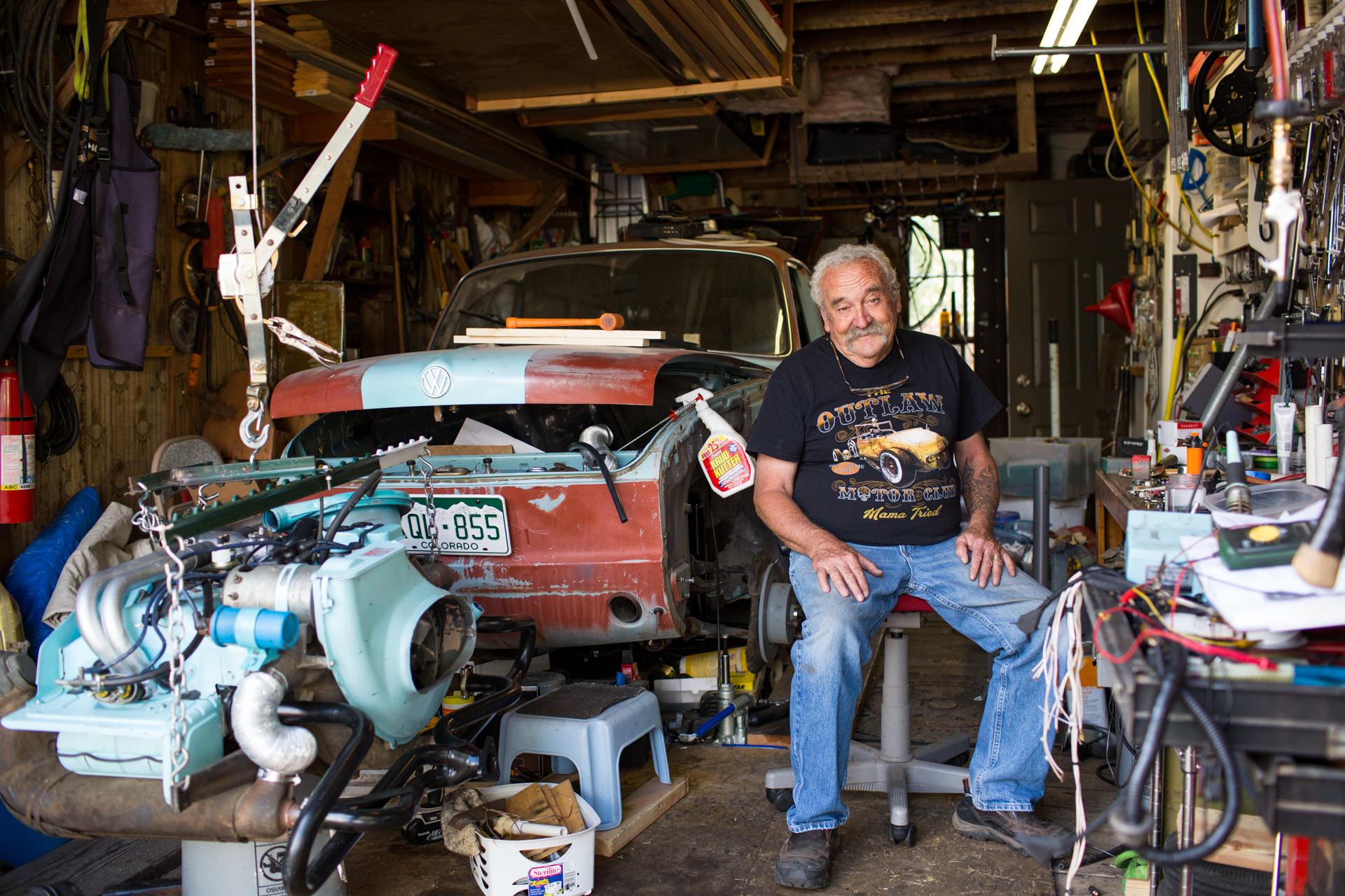 Robert Wood Johnson Foundation - William Schweizer, Sr. works on a car in his garage in...