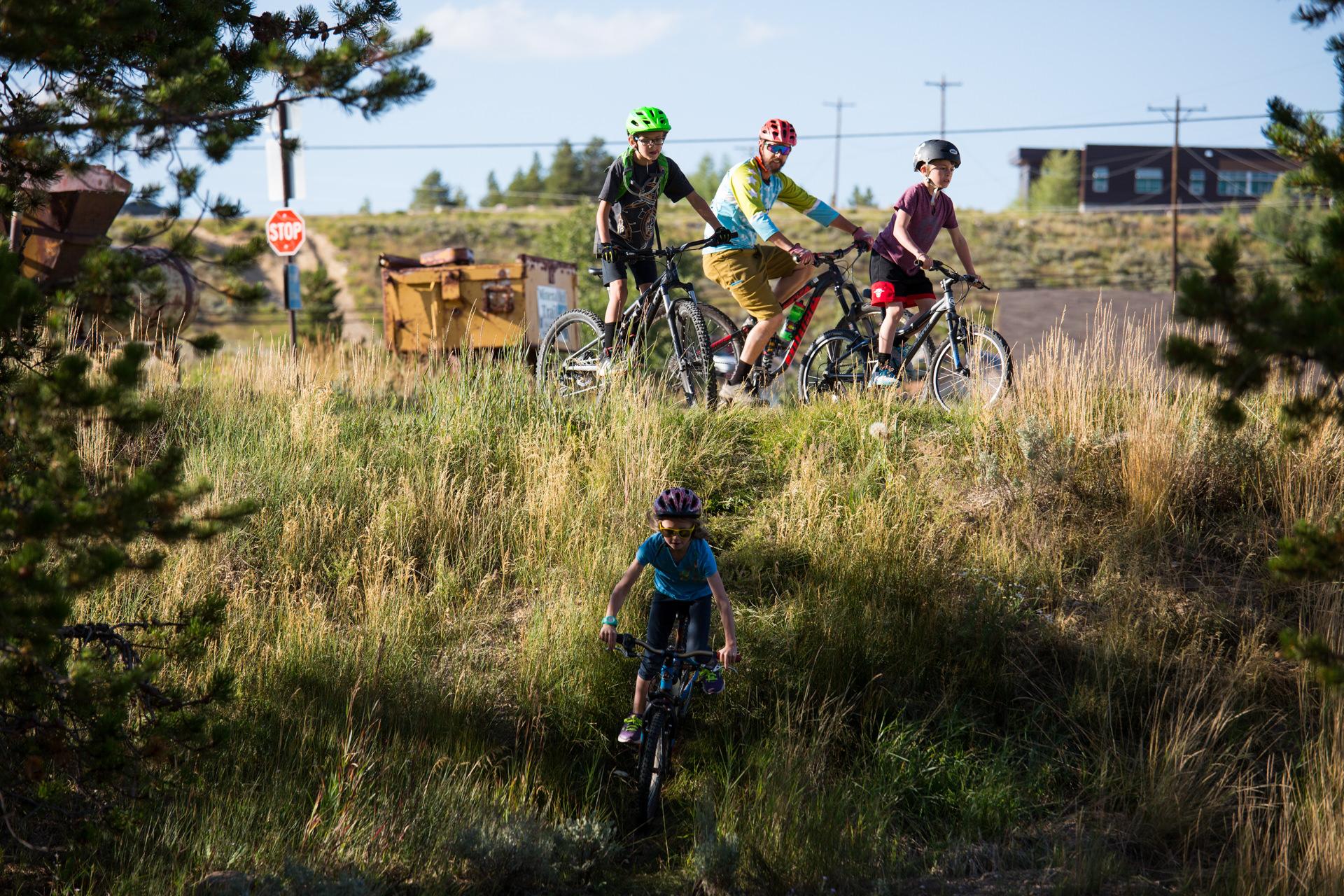 Robert Wood Johnson Foundation - Kids warm up on their bikes before a family trail ride...