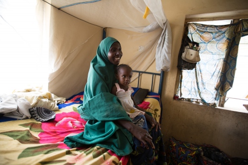 Nation - A displaced woman from Jos poses with her child. She...