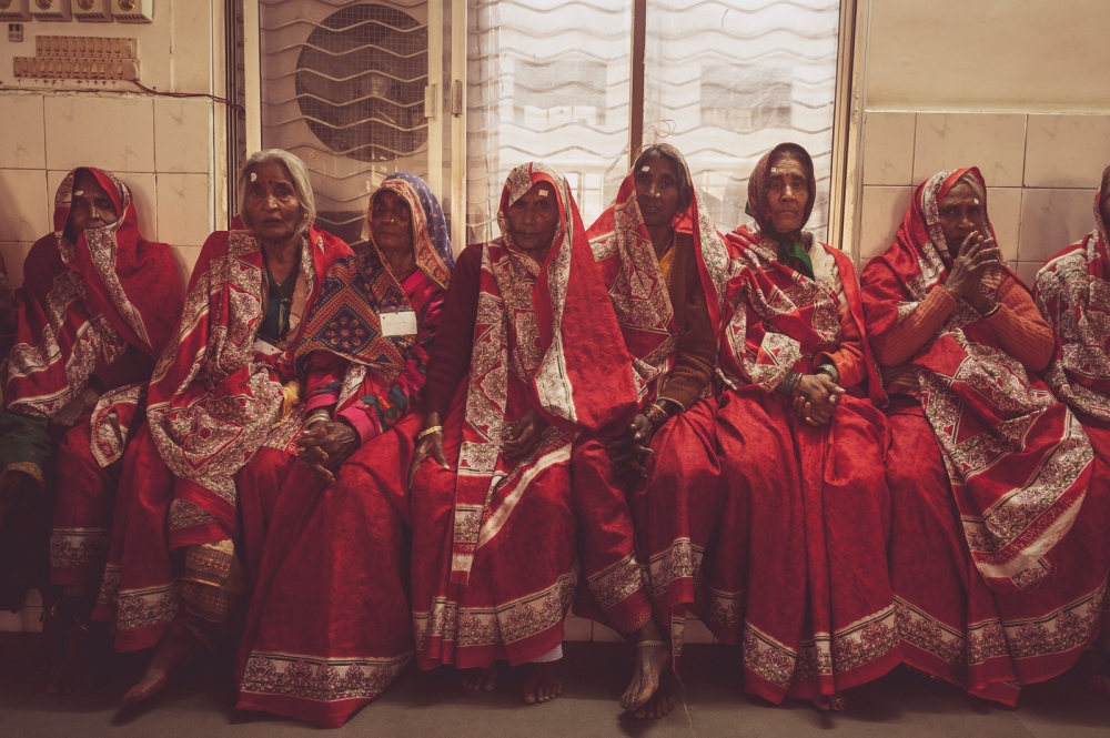 Image from FINDING LIGHT IN THE DARKNESS - Women wait in their surgical sarees to undergo cataract...