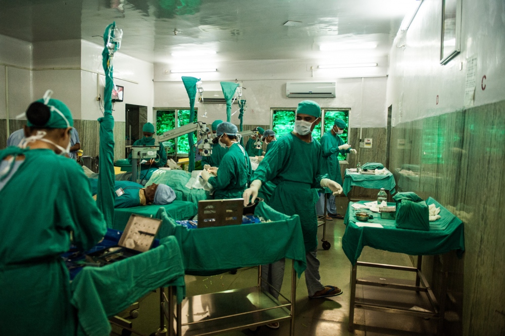 FINDING LIGHT IN THE DARKNESS - Inside one of the five operating theatres multiple...