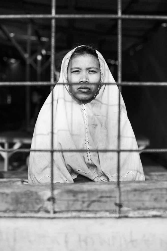 Mental Health in Indonesia - A female patient in the female section of the communal...