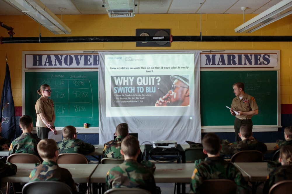 Young Marines attend a meeting ...tism, and drug-free lifestyles.