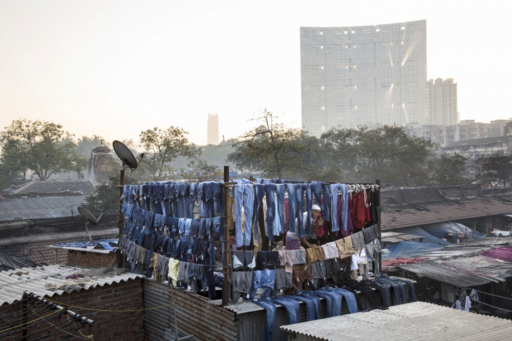 SINGLES - Clothes are hung to dry in Dhobi Ghats which everyday...