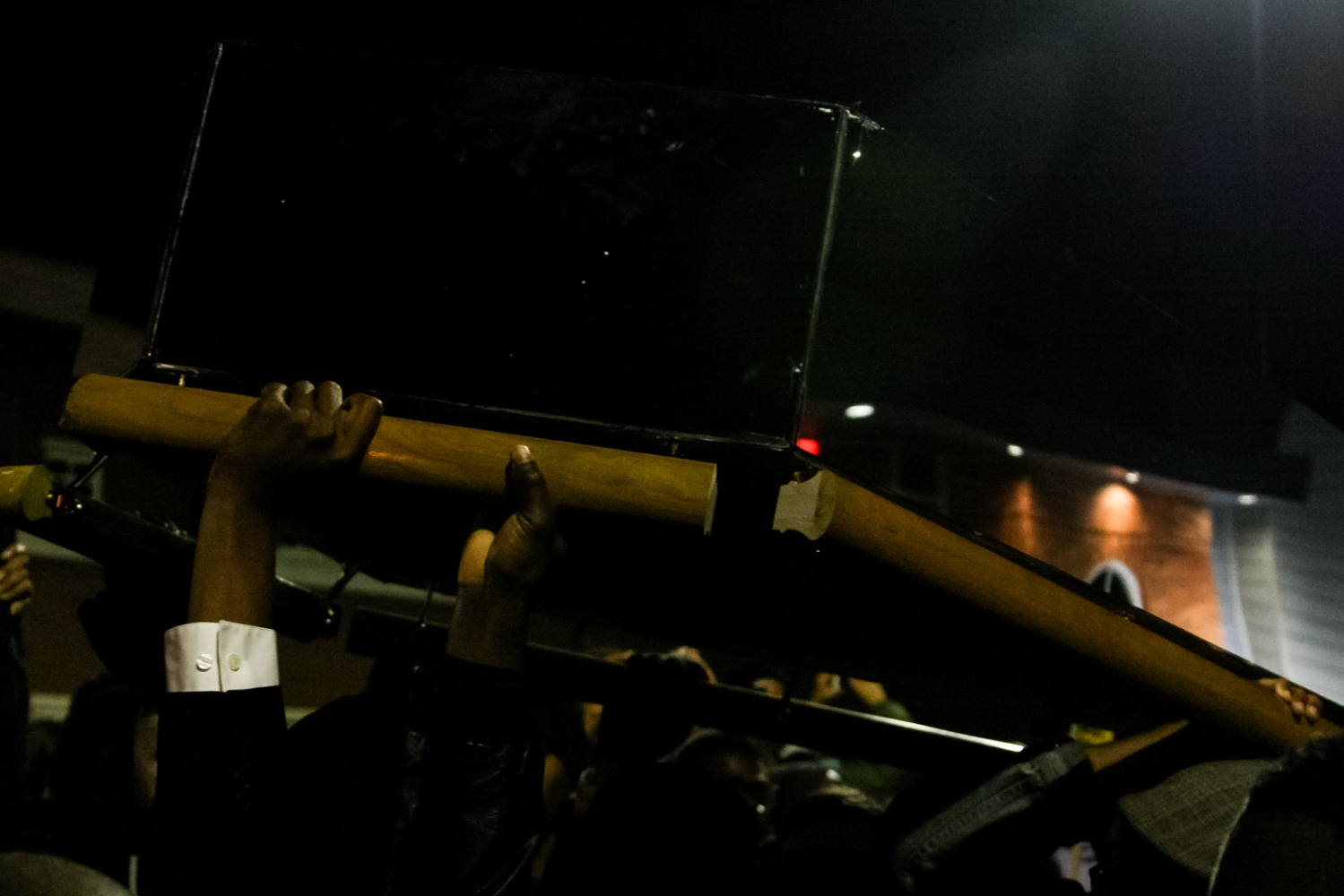 Ferguson October - Activists carry an empty coffin towards the Ferguson...