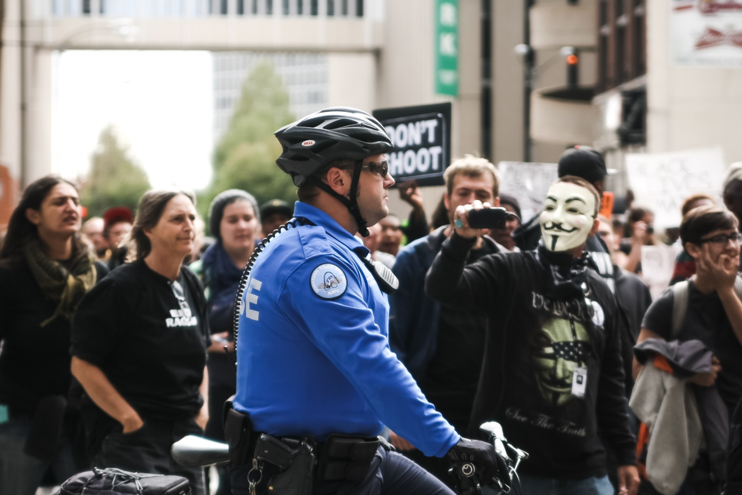 A St. Louis police officer blocks a street as activists march through St. Louis.