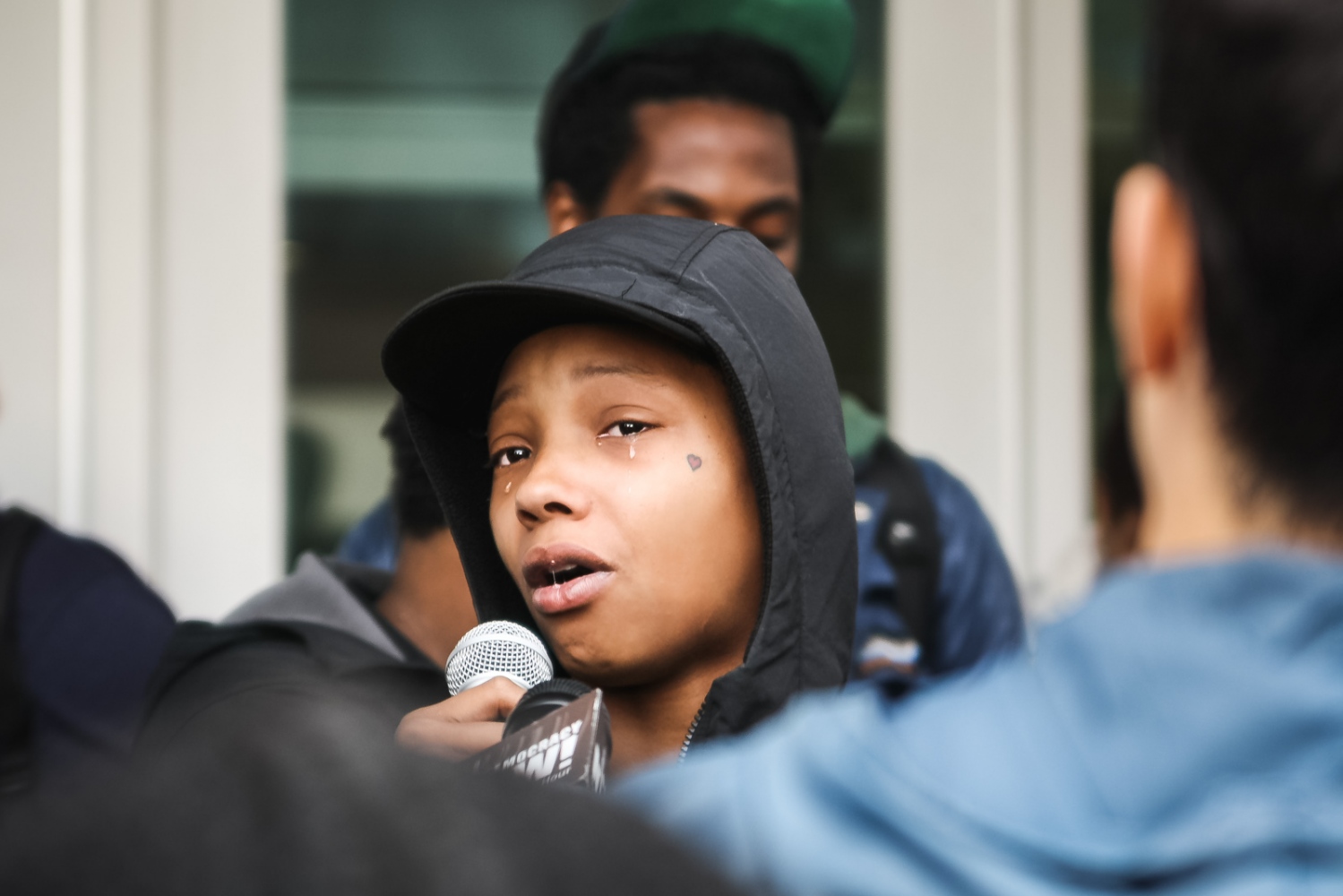 Ferguson October - A young Black mother cries in front of the St. Louis...