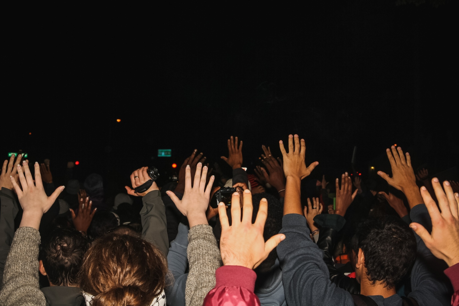 Ferguson October - Activists chant "Hands Up! Don't Shoot!"...