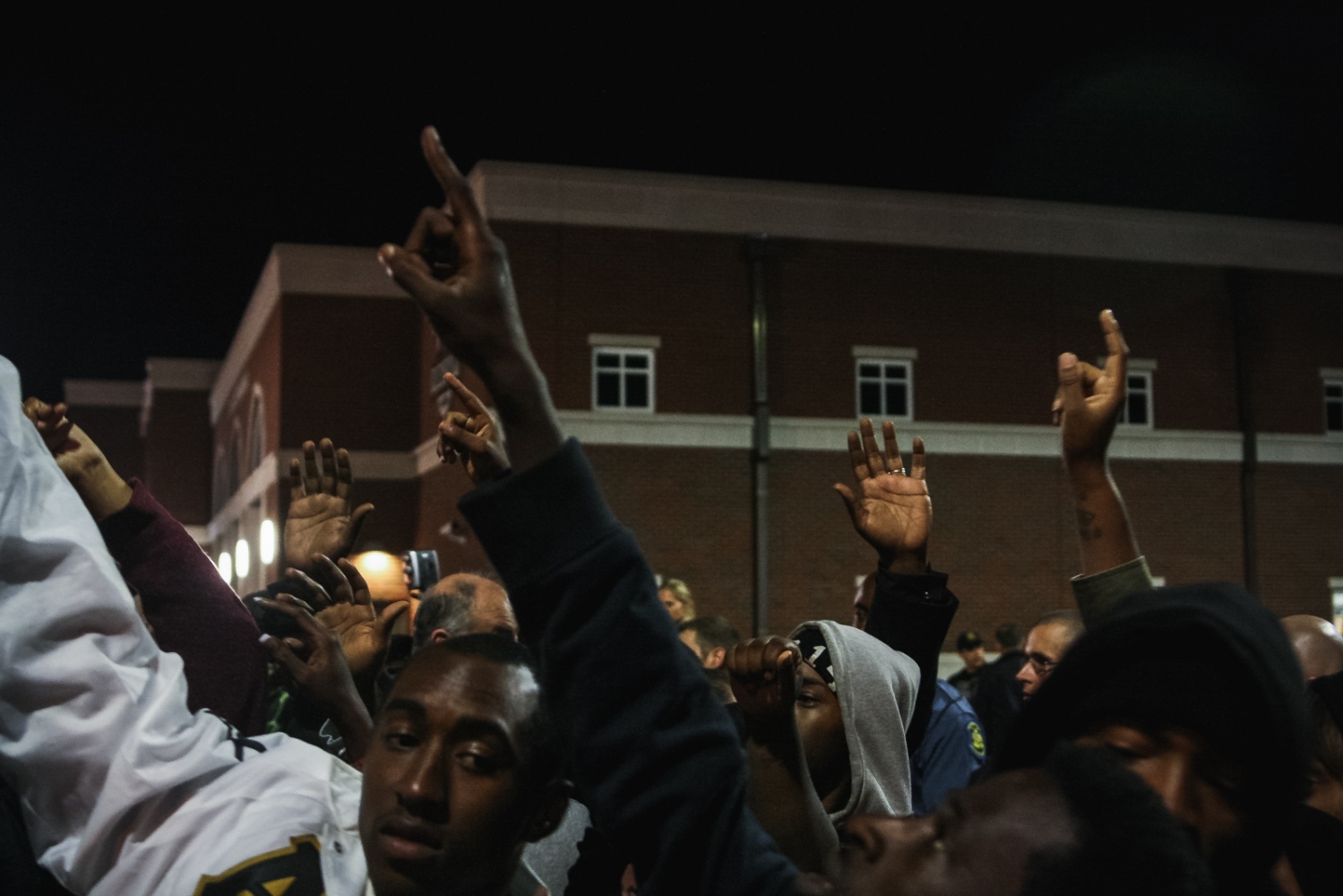 Ferguson October - Community members and supporters protesting in front of...
