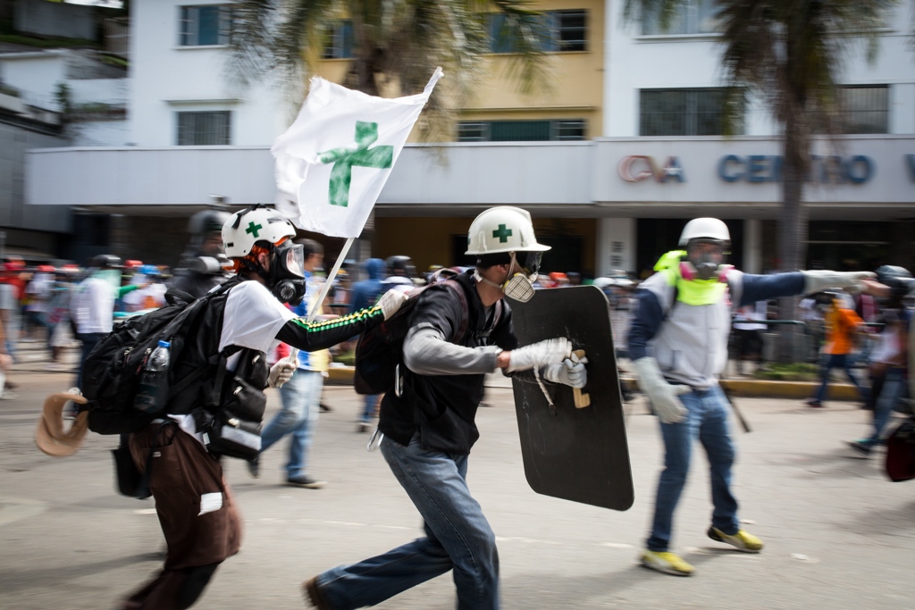 Green Cross - Volunteers members of green cross run to reach and give...