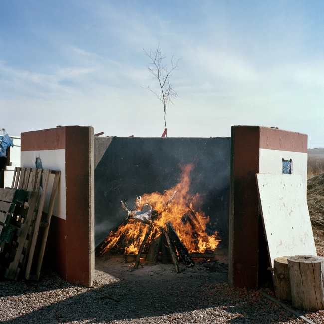 Nobody Listened - Wood burns in preparation for a sweat lodge on the...