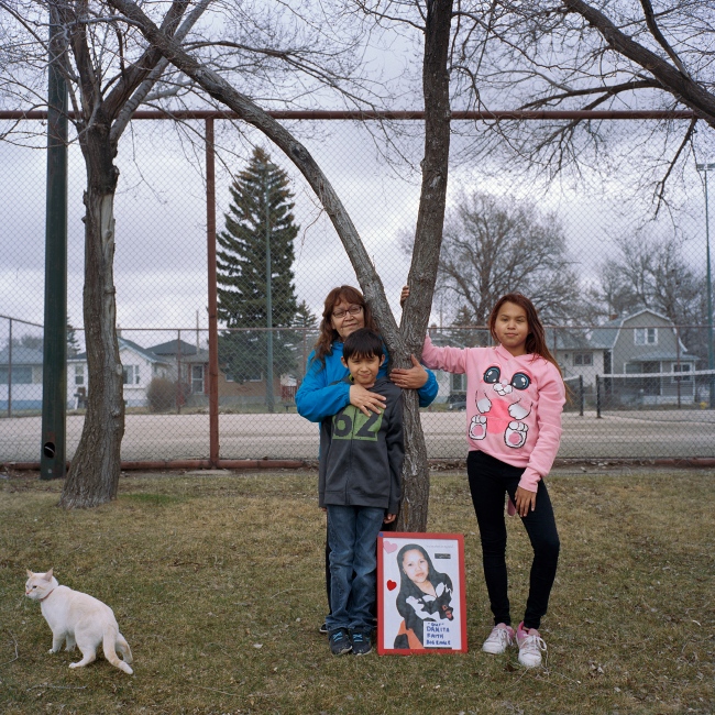 Diane Big Eagle is pictured with her grandchildren Cassidy, 14 and Talon, 10 and their cat Waffles in their favorite park in Regina, Saskatchewan. Diane&rsquo;s daughter, Danita Big Eagle, disappeared over ten years ago and her case remains unresolved. Diane has been caring for her grandchildren since: &ldquo;I want them to be happy,&rdquo; she said. &ldquo;When I&rsquo;m sad, they&rsquo;re sad, when I get depressed, they get depressed. If I can manage to cope, so will they. I have to make them think she&rsquo;s somewhere out there&hellip;that she&rsquo;s coming back.&rdquo; 