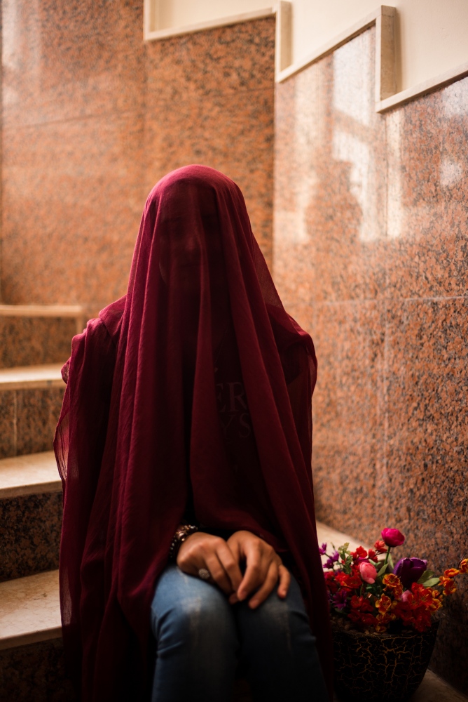 Suzanne, 20, whose name has been changed, poses for a photo at the Jinda Center, a women's...
