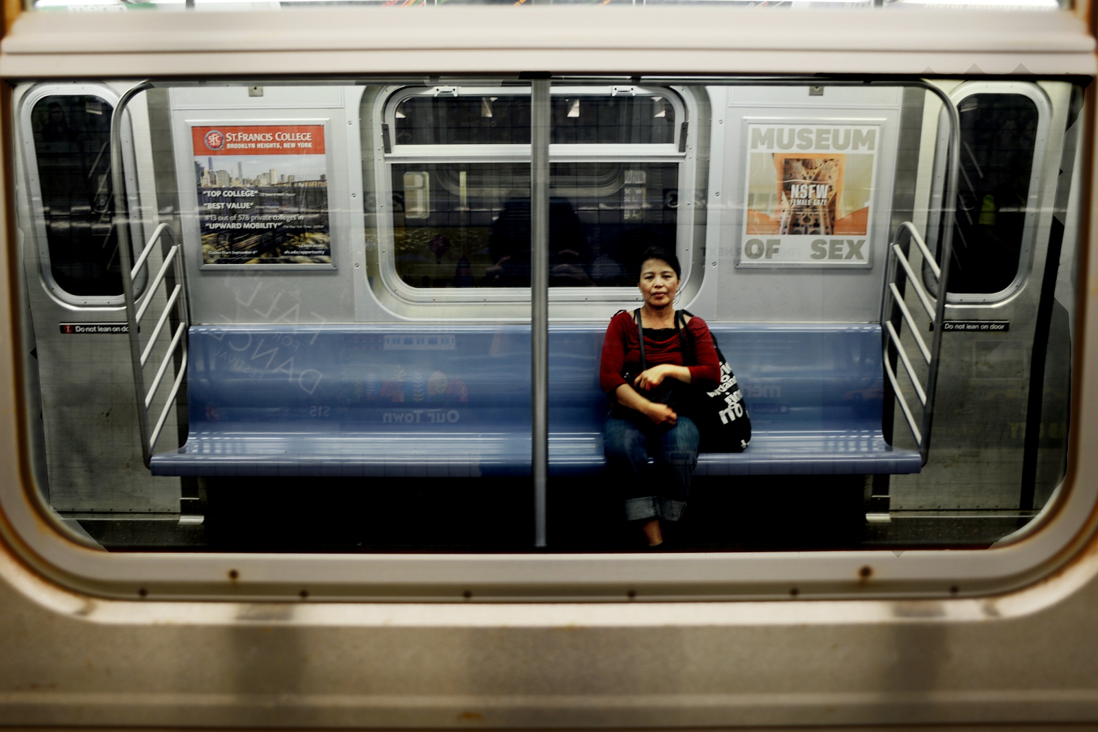 "In short, I was a slave" - Edith Mendoza, 51, heads home on the E train after work...