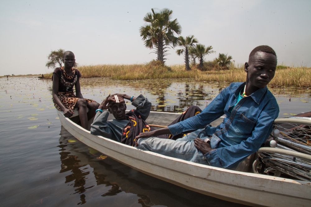 How canoes are saving lives  -  An Oxfam wash personnel (right) going with the team to...