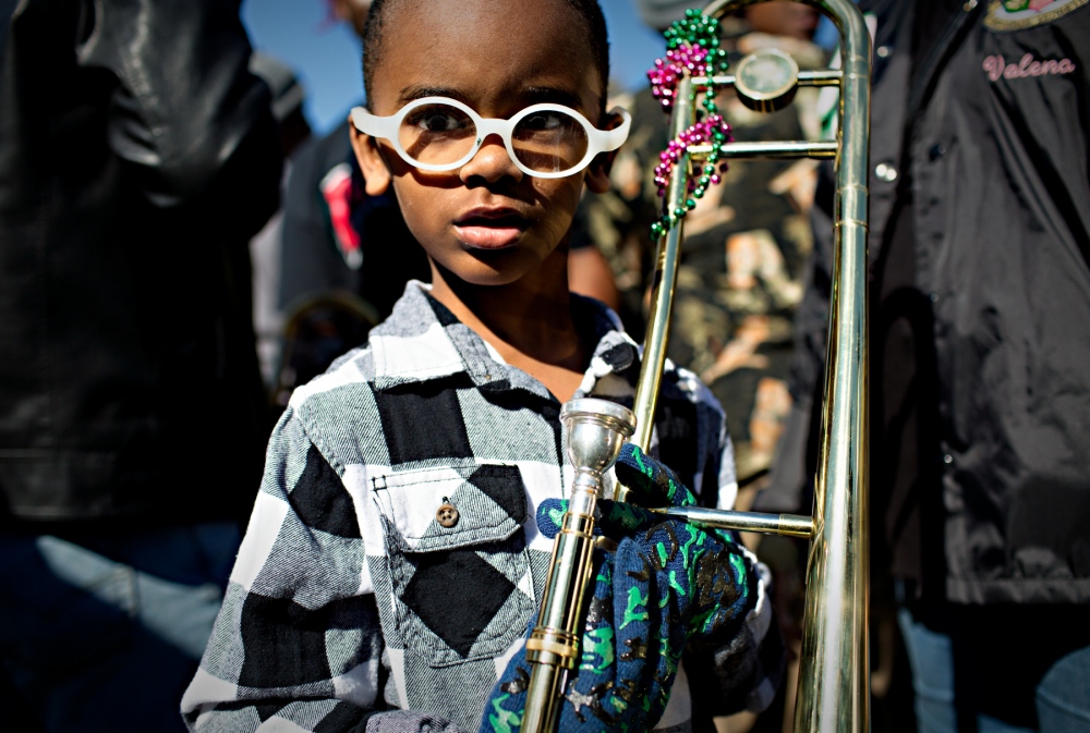 Five years old Alvin Coco has p...e main band leading the parade.