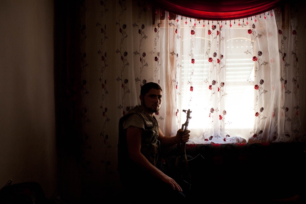 A fighter from the Free Syrian ...ed to fight alongside the FSA. 
