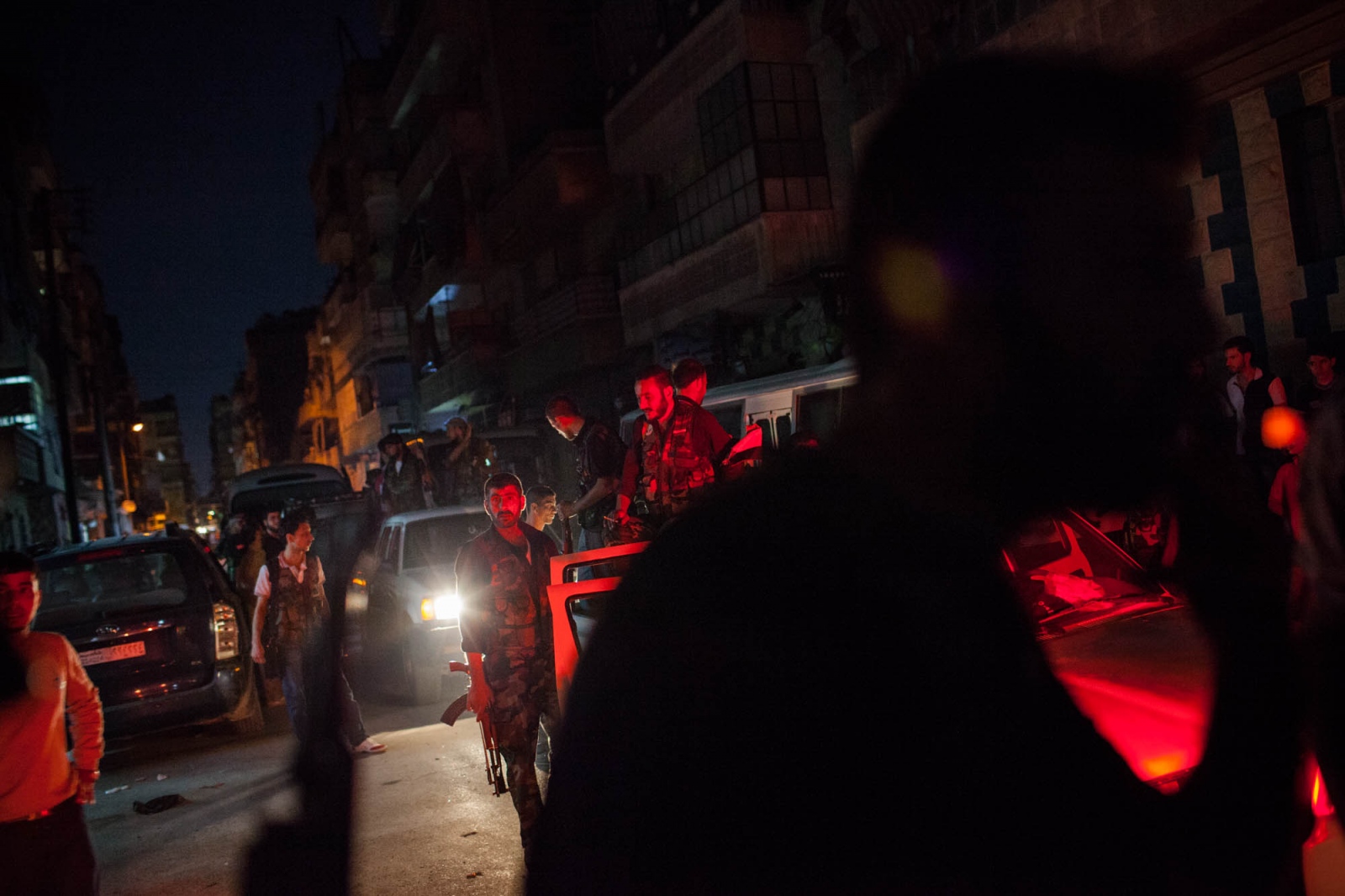 Fighters with the Free Syrian Army prepare to enter the neighborhood of Ezza&#39;a in Aleppo,...