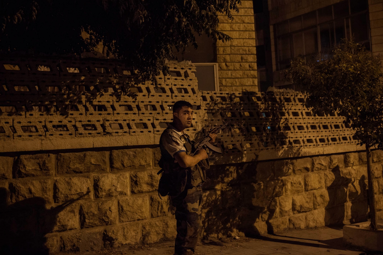A fighter with the Free Syrian Army prepares for a firefight in the neighborhood of...