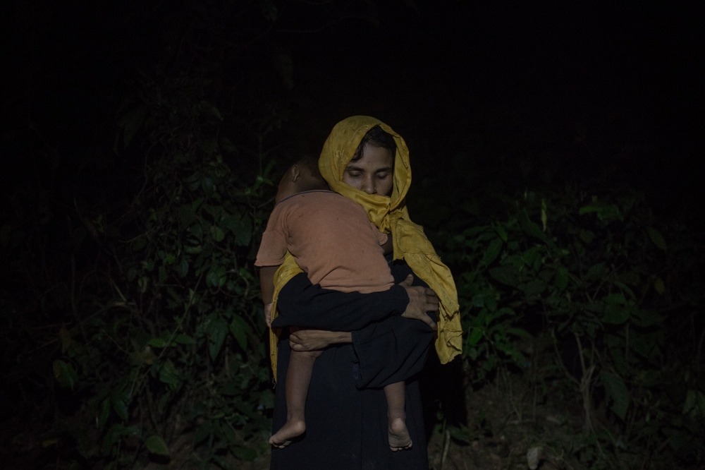  Kulsuma, 30, embraces her son ... know the fate of her husband. 